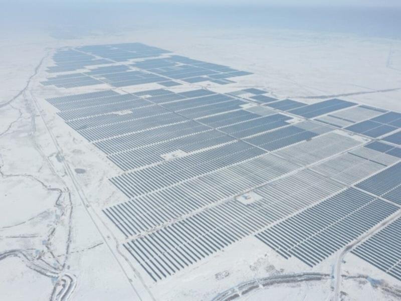 Aerial view of the M-Kat 100 MWp utility-scale solar plant in Kazakhstan under snow
